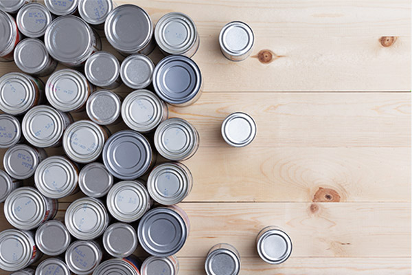 Many different sizes of canned goods, viewed from the top.