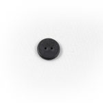 Photo of single WayTag button with two holes