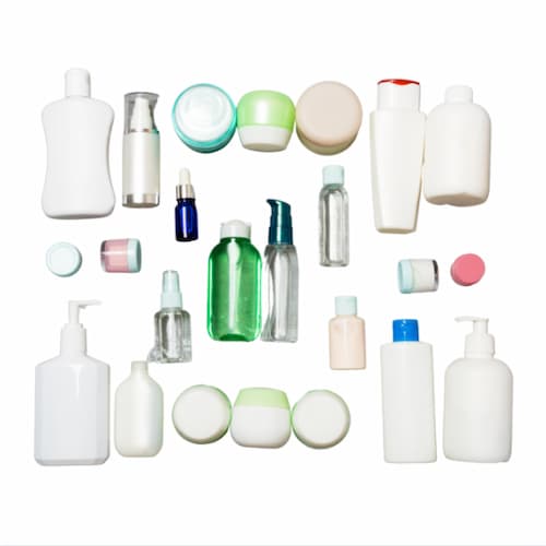Various sized empty self-care bottles for hairspray, lotions, and more on a white background