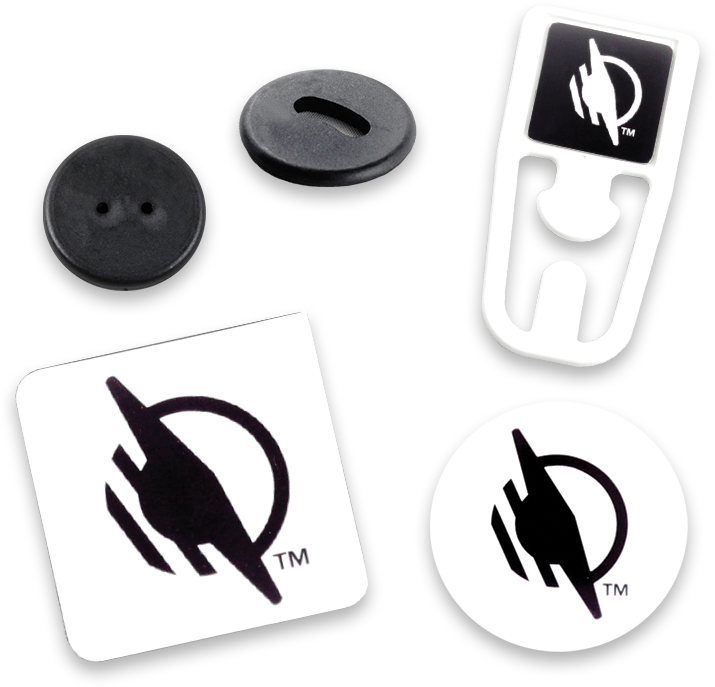 Various types of WayTag NFC tags spread out including WayTag double-hole buttons, WayTag oval hole buttons, WayTag magnets, WayTag stickers, and WayTag on metal plastic clips 