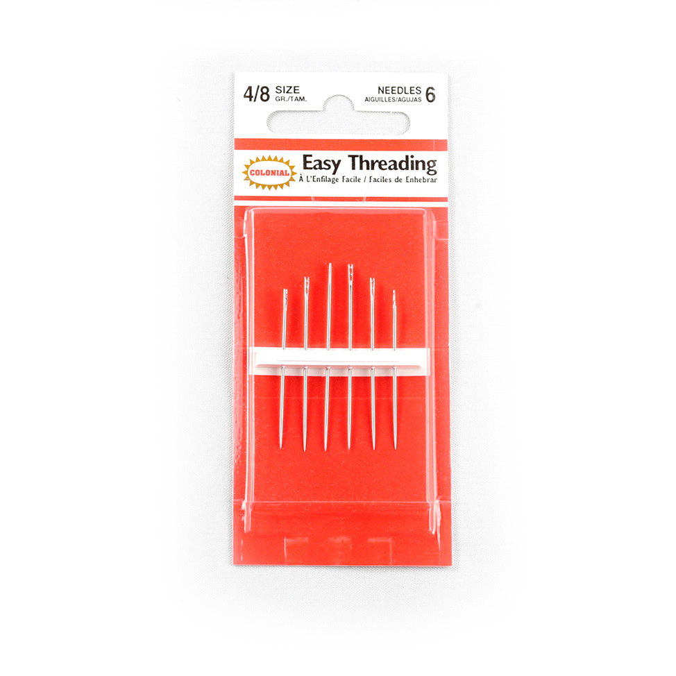Six self-threading needles in a plastic package